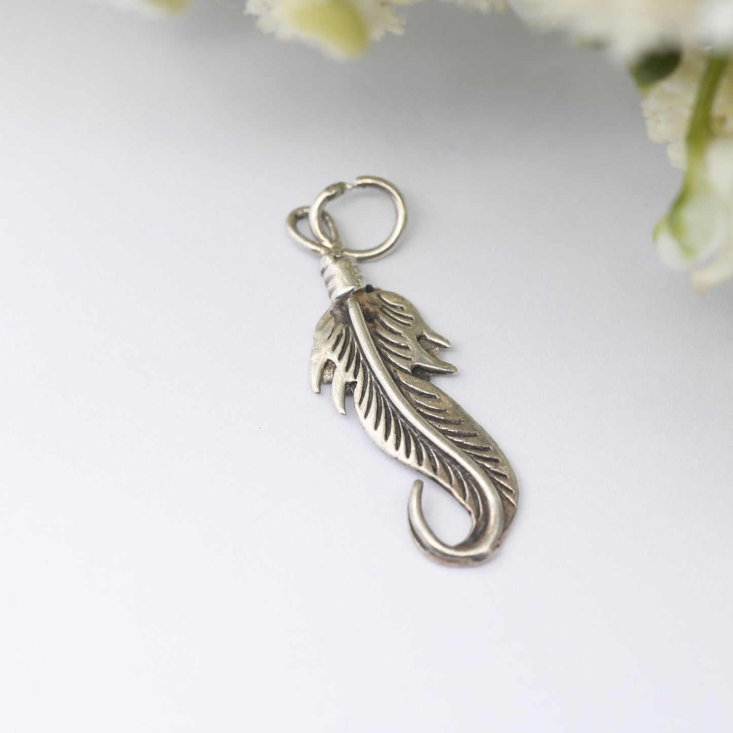 Vintage Navajo Silver Feather Charm Pendant - Spiritual Symbol of Power and Freedom | Twisted Bird's Feather