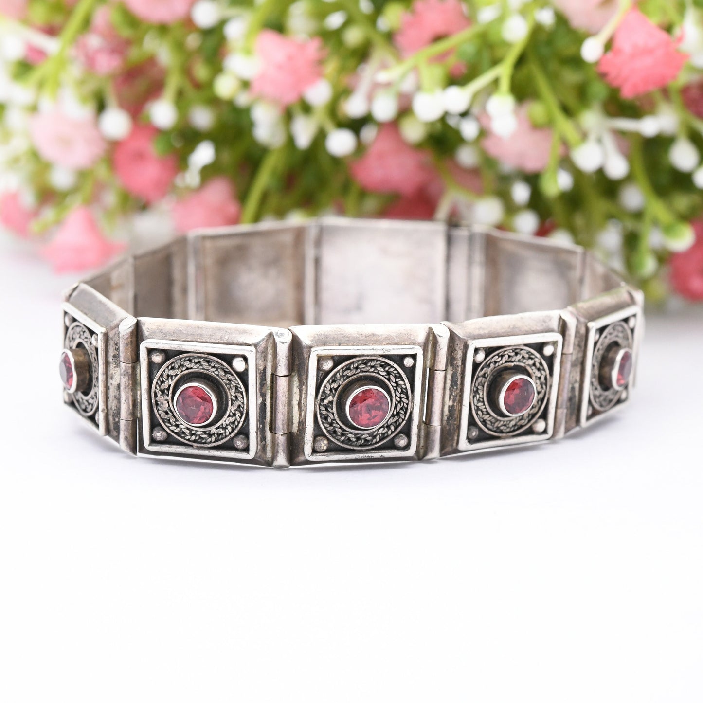 Vintage Sterling Silver Garnet Panel Bracelet with Ornate Rope Design