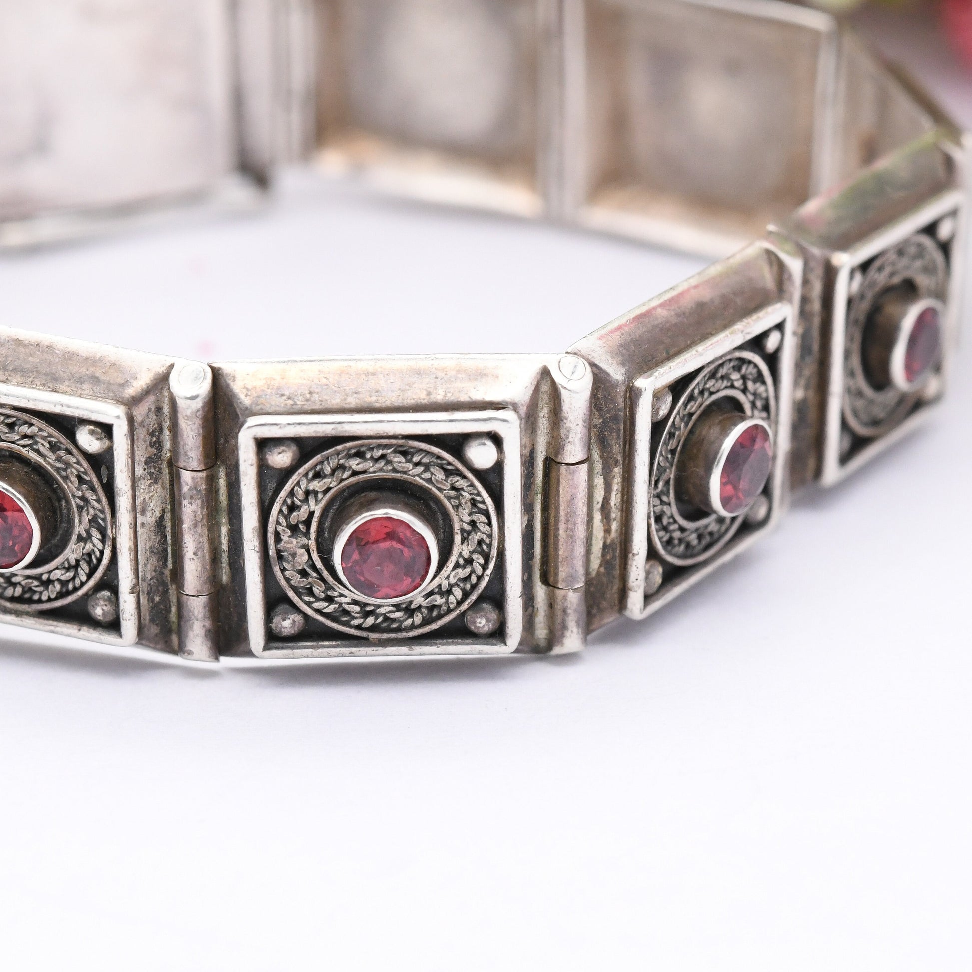 Vintage Sterling Silver Garnet Panel Bracelet with Ornate Rope Design