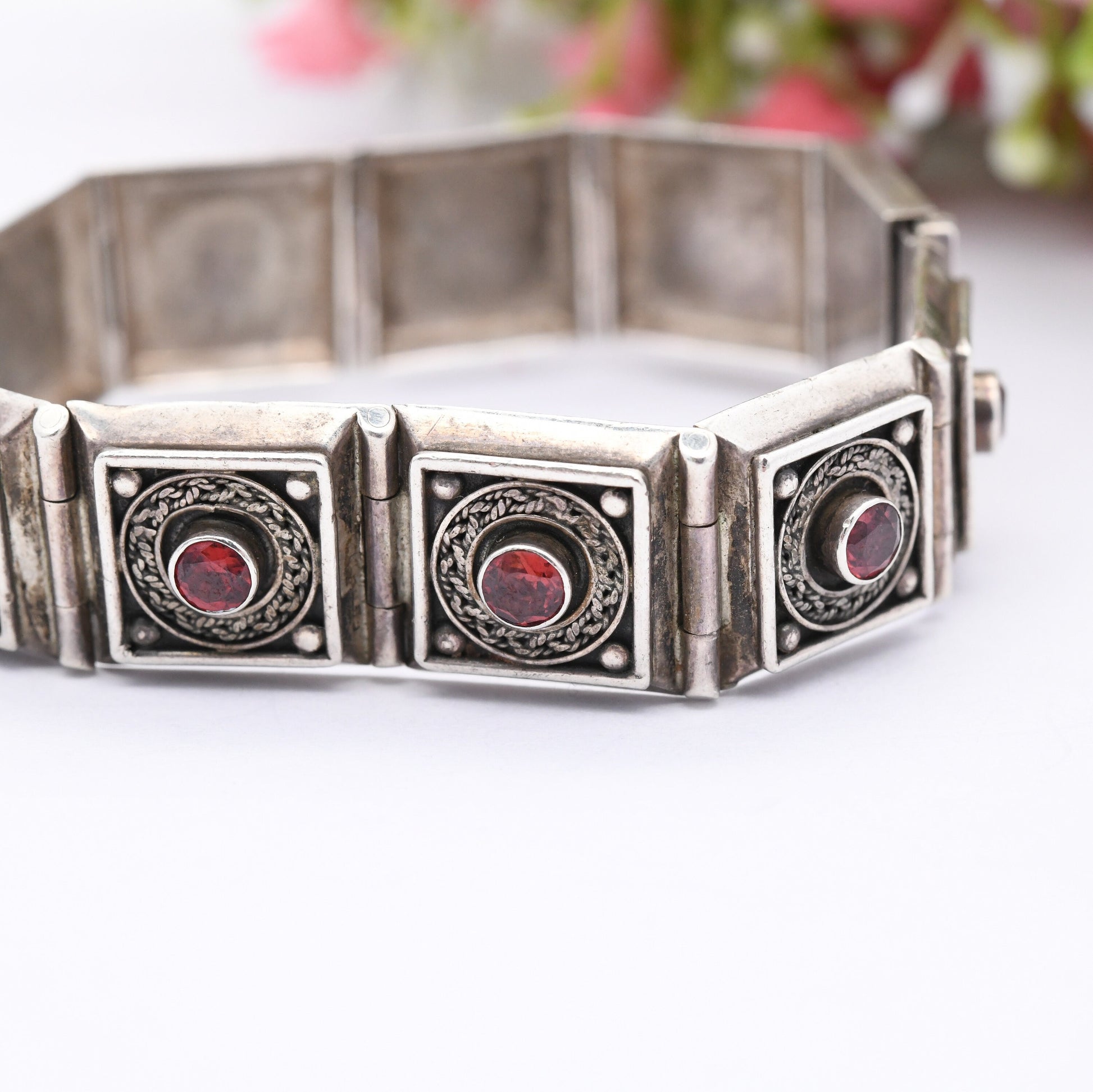 Vintage Sterling Silver Garnet Panel Bracelet with Ornate Rope Design