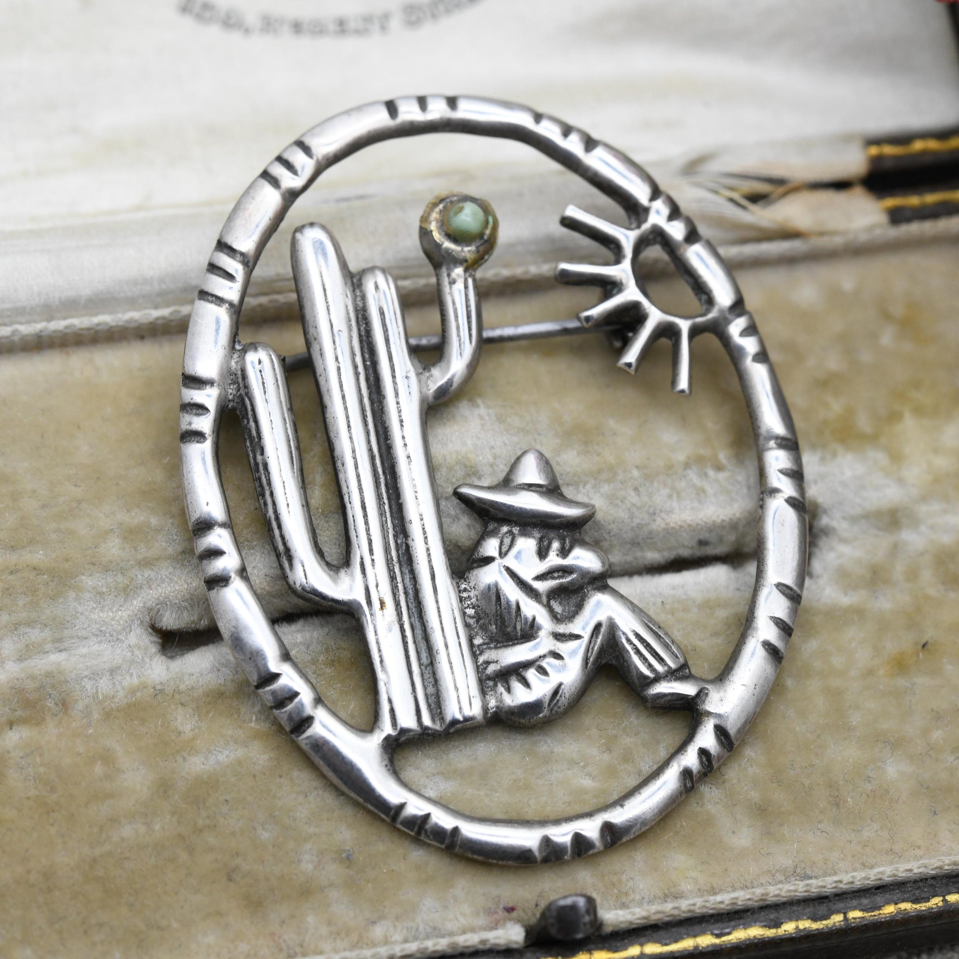 Vintage Mexican Silver Cactus and Man Openwork Brooch with Green Gemstone