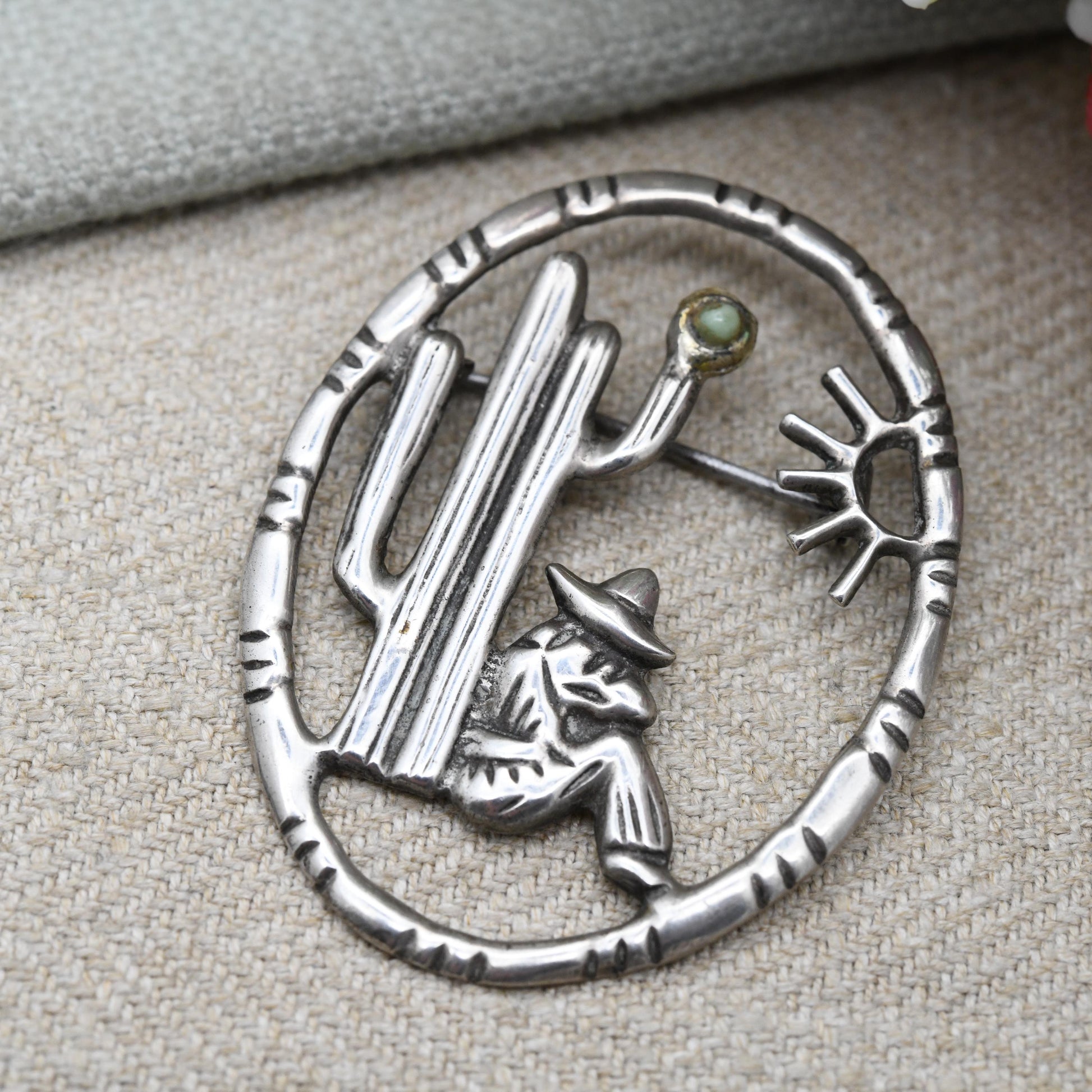 Vintage Mexican Silver Cactus and Man Openwork Brooch with Green Gemstone