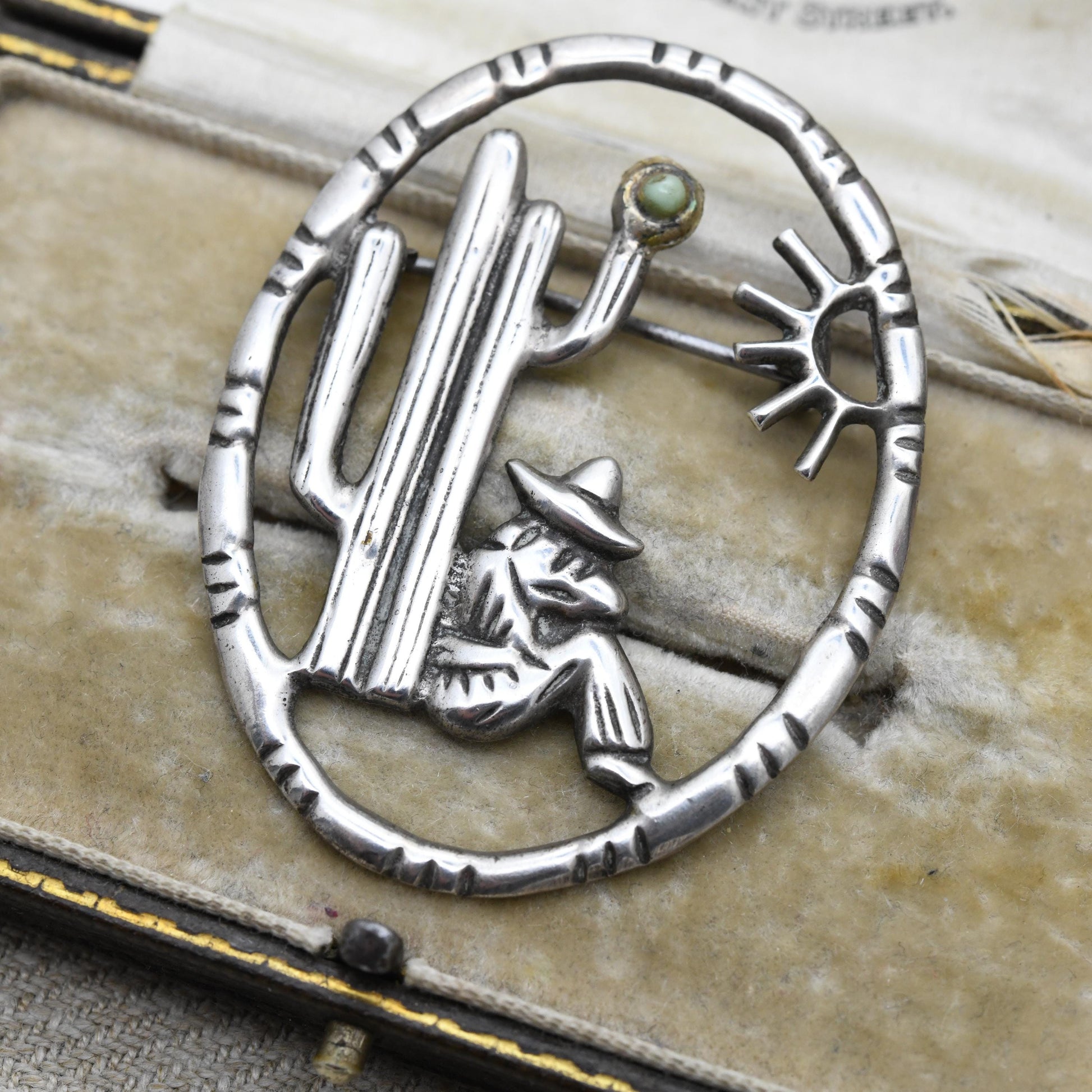 Vintage Mexican Silver Cactus and Man Openwork Brooch with Green Gemstone