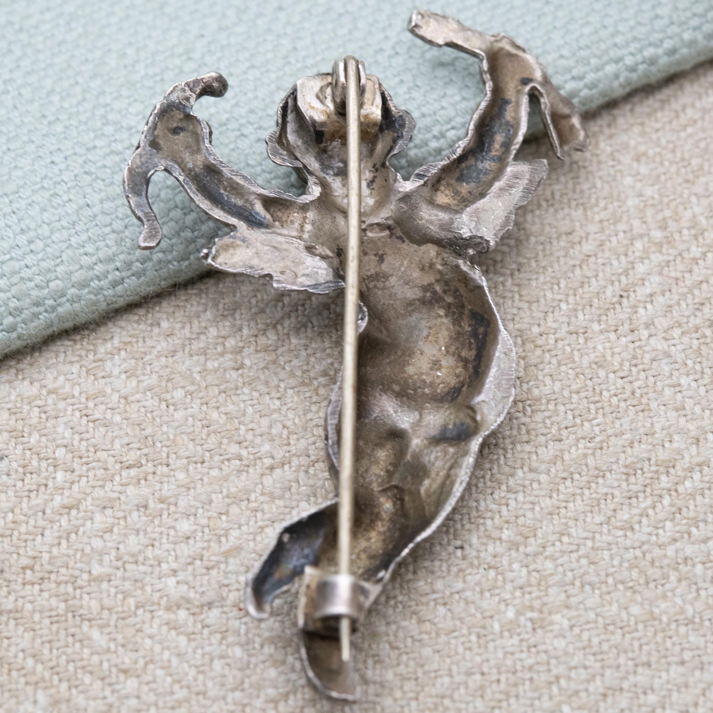 Antique Art Nouveau Repoussé Cherub Brooch c. 1900 - Winged Cupid with Bow and Arrows