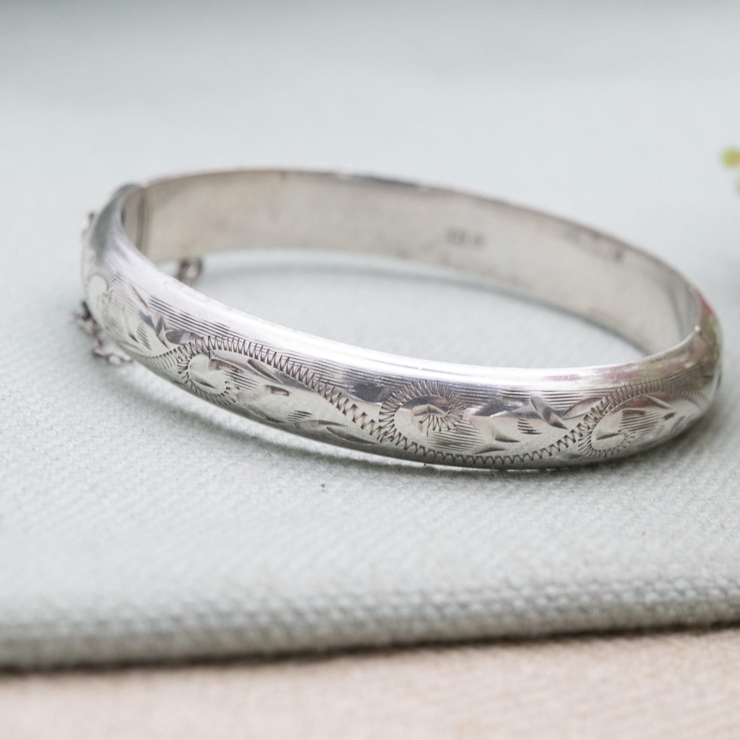 Vintage Sterling Silver Floral Engraved Bangle Bracelet 1972 - Textured Victorian Aesthetic Scrolling Style with Safety Chain