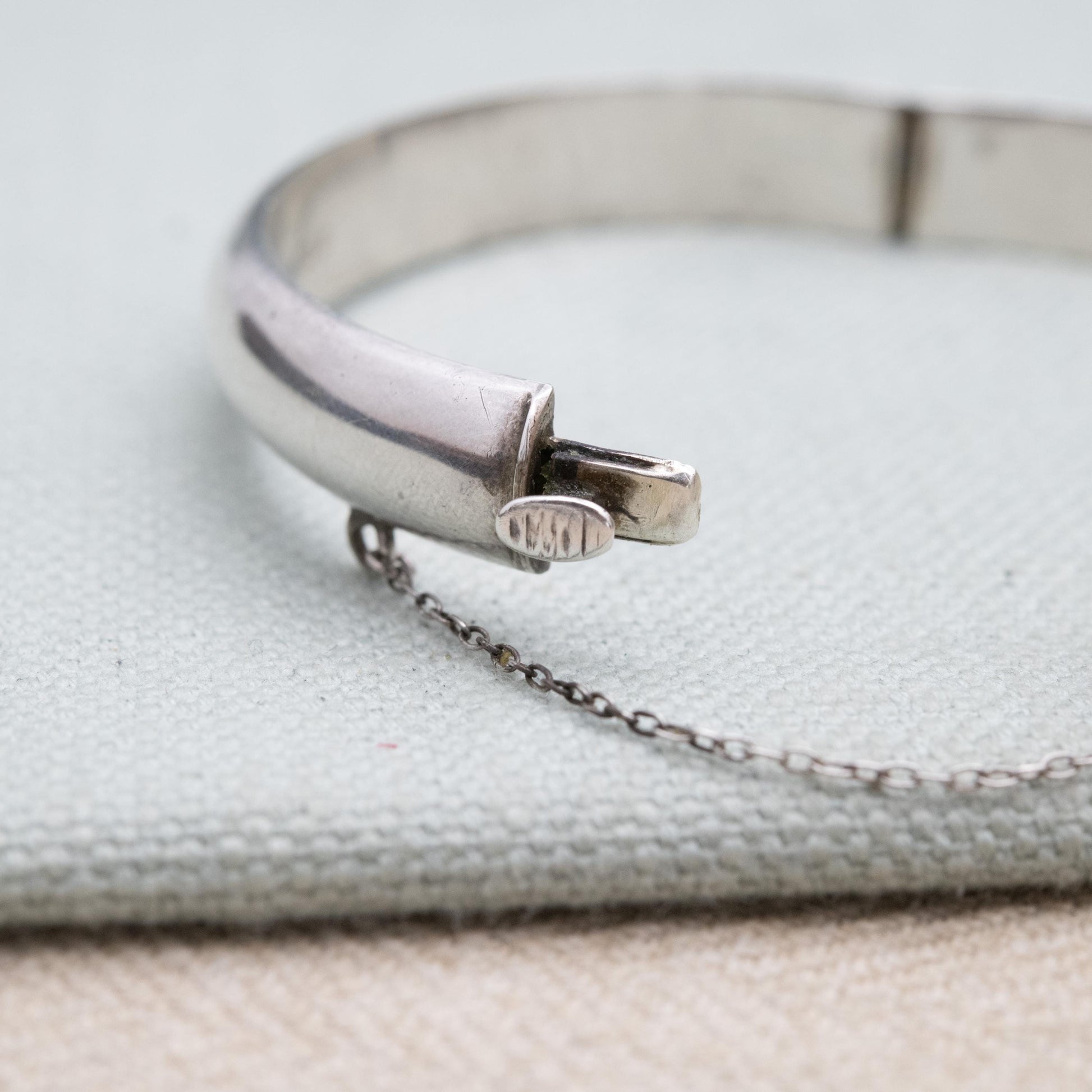 Vintage Sterling Silver Floral Engraved Bangle Bracelet 1972 - Textured Victorian Aesthetic Scrolling Style with Safety Chain