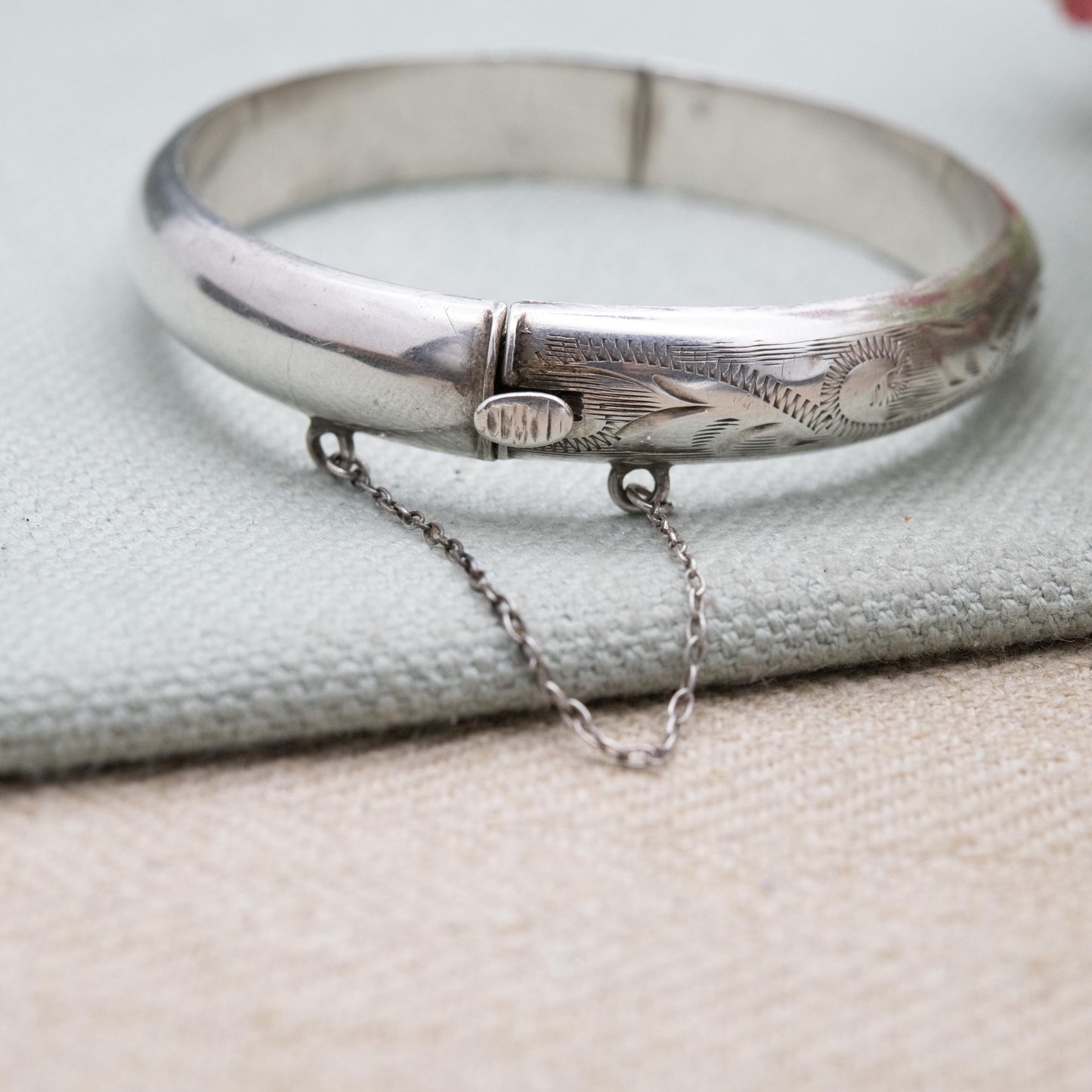 Vintage Sterling Silver Floral Engraved Bangle Bracelet 1972 - Textured Victorian Aesthetic Scrolling Style with Safety Chain
