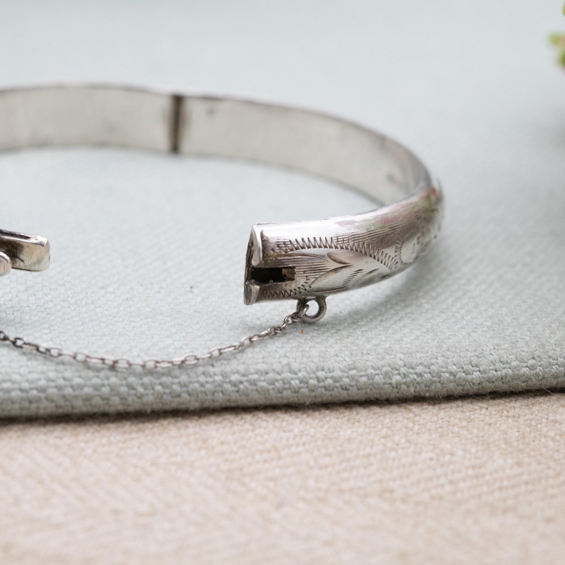 Vintage Sterling Silver Floral Engraved Bangle Bracelet 1972 - Textured Victorian Aesthetic Scrolling Style with Safety Chain