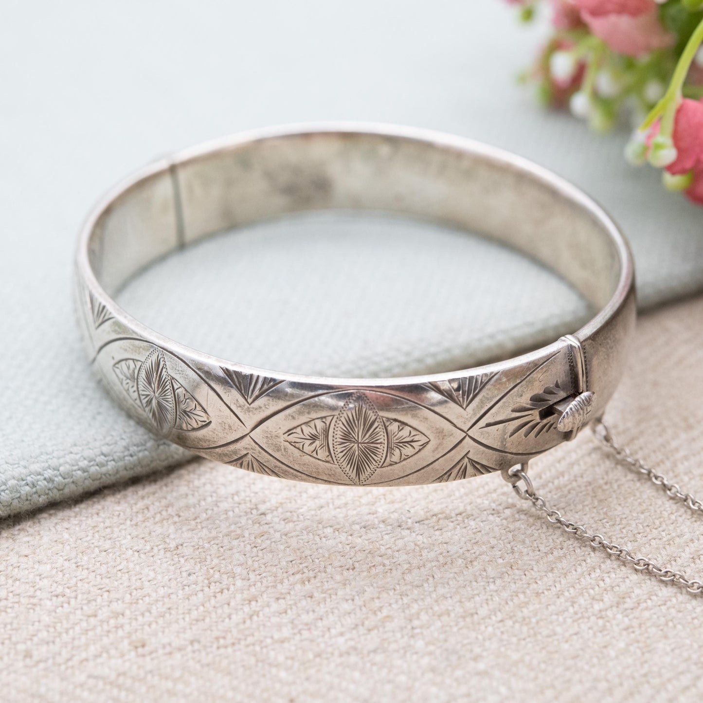 Vintage Sterling Silver Floral Engraved Bangle Bracelet 1966 - Chunky Victorian Aesthetic Scrolling Style with Safety Chain