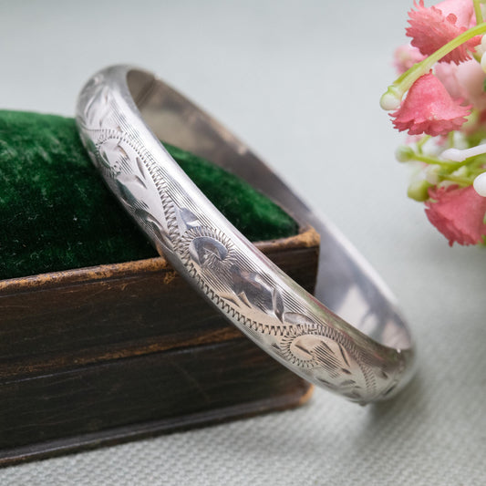 Vintage Sterling Silver Floral Engraved Bangle Bracelet 1972 - Textured Victorian Aesthetic Scrolling Style with Safety Chain