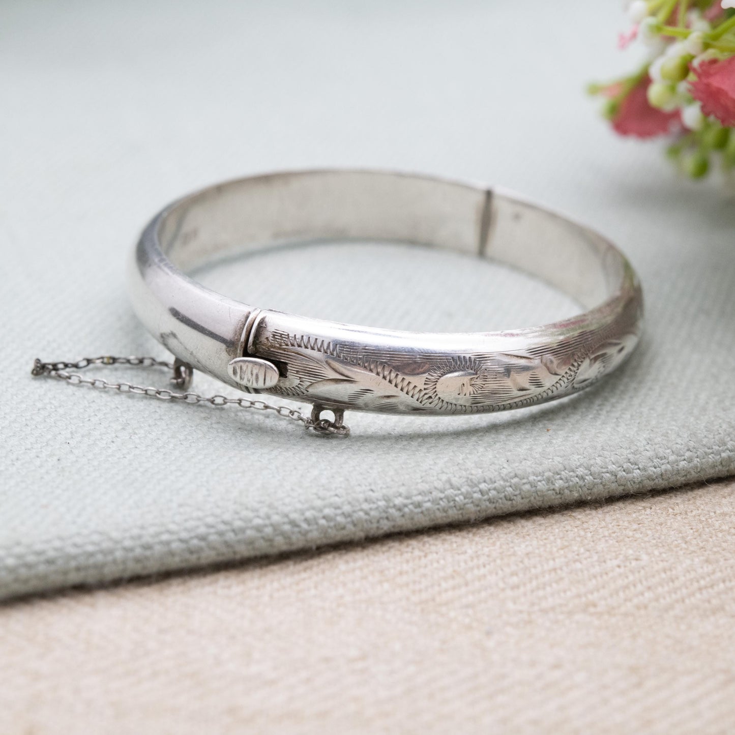 Vintage Sterling Silver Floral Engraved Bangle Bracelet 1972 - Textured Victorian Aesthetic Scrolling Style with Safety Chain