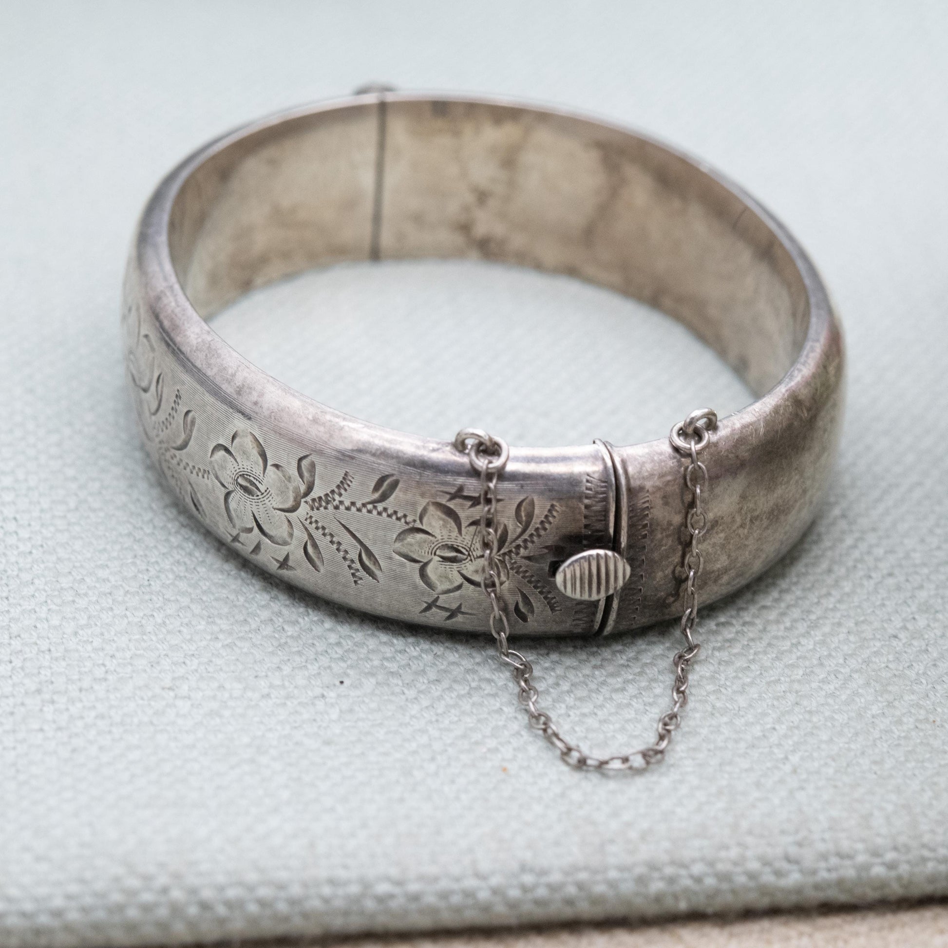 Vintage Sterling Silver Engraved Bangle Bracelet 1969 - Chunky Victorian Aesthetic Scrolling Style with Safety Chain