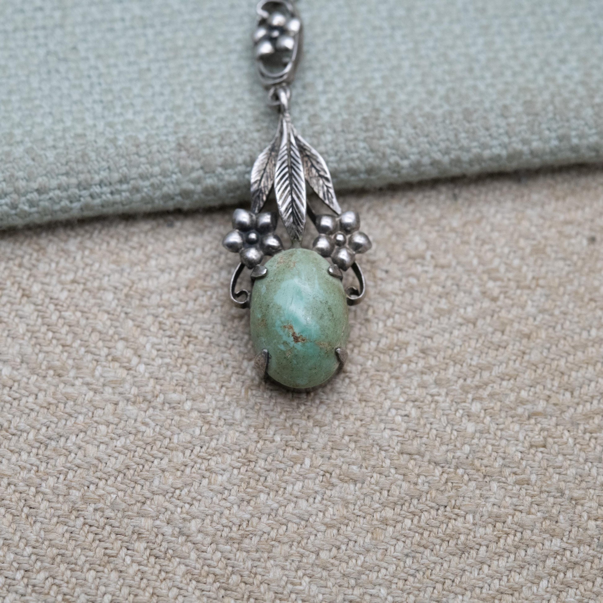 Antique Arts and Crafts Silver Flower Pendant with Green Cabochon Stone c. 1910s