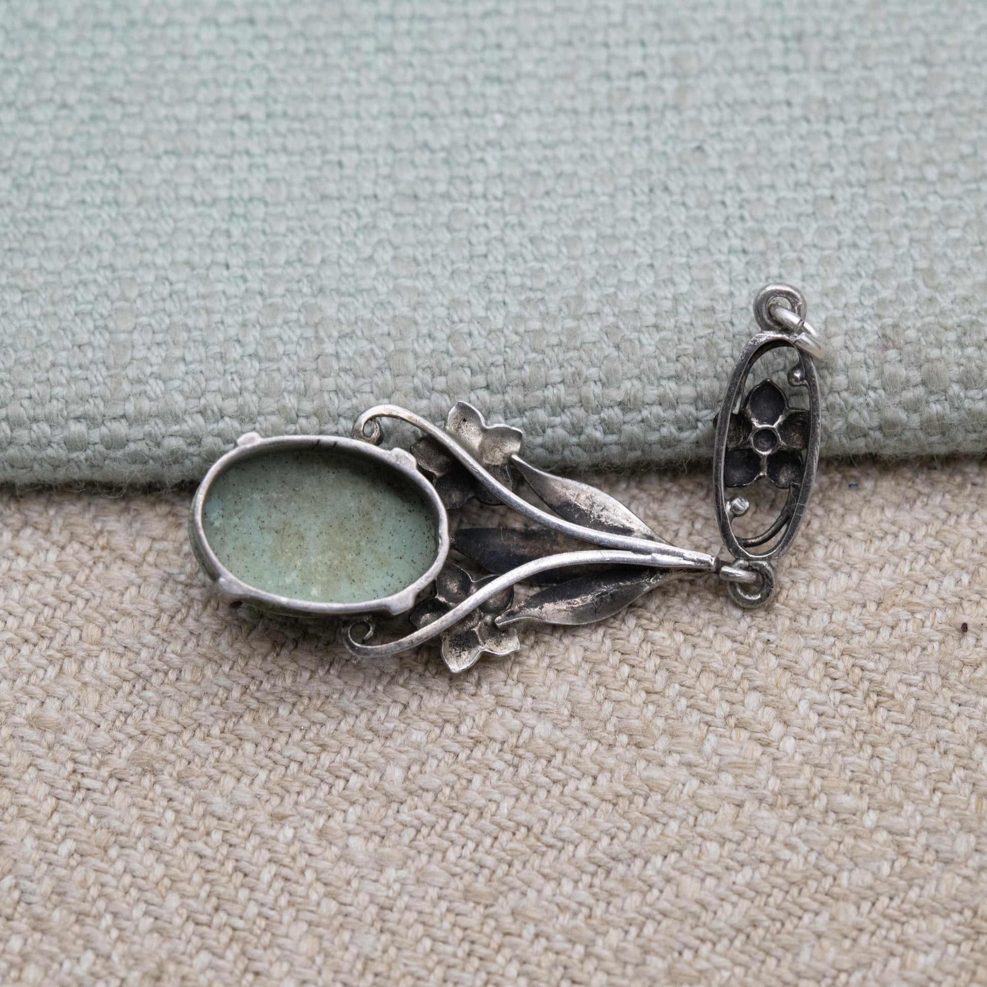 Antique Arts and Crafts Silver Flower Pendant with Green Cabochon Stone c. 1910s
