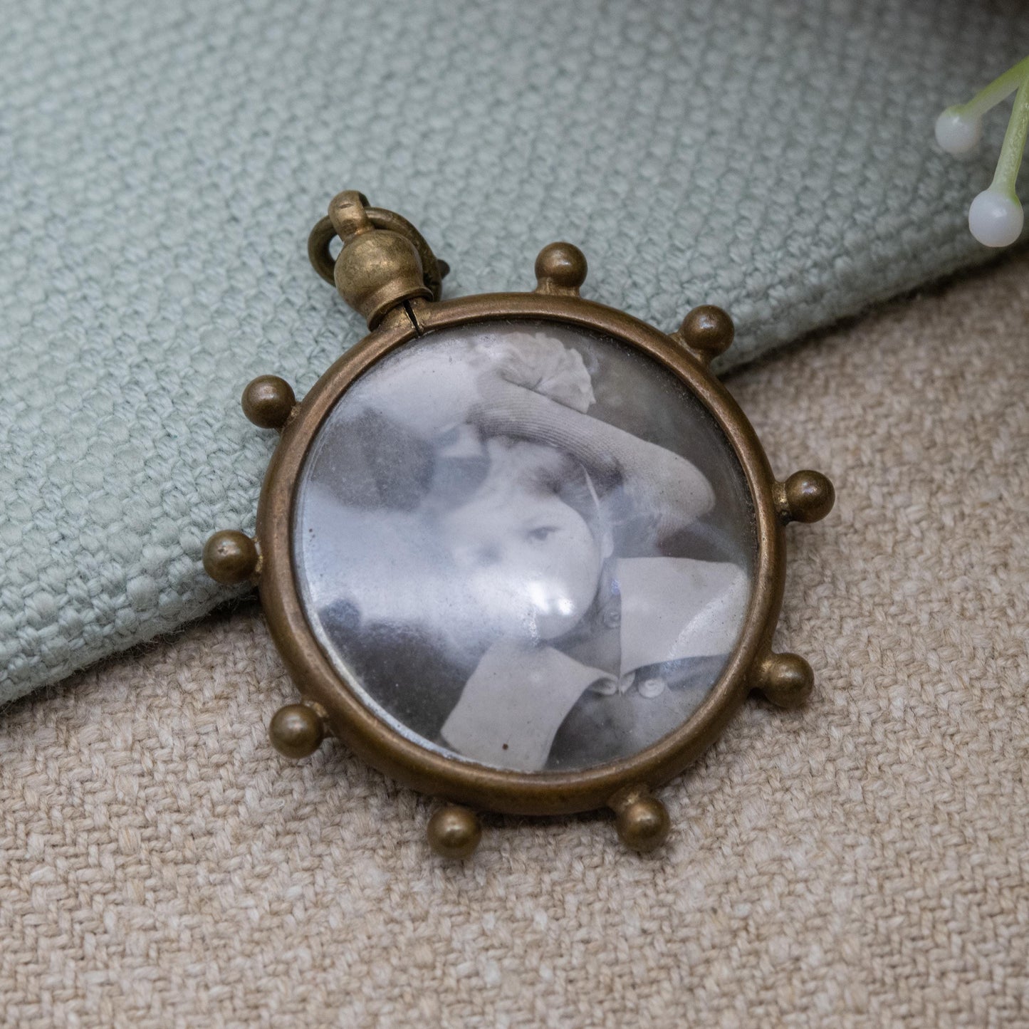 Antique Double Sided Locket Pendant Fob with Photographs Inside c. 1910 - Ship's Wheel Design with Granulated Edges