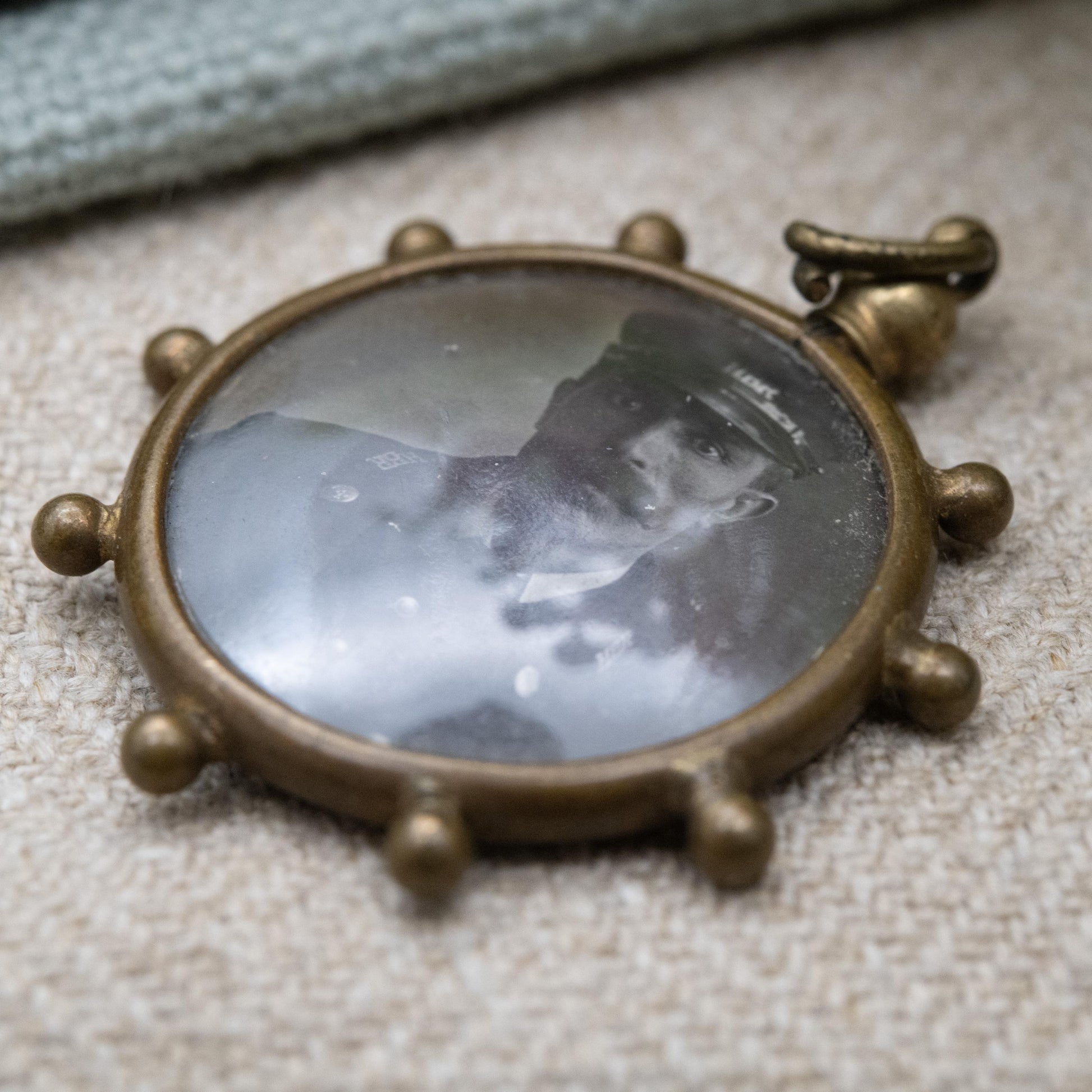 Antique Double Sided Locket Pendant Fob with Photographs Inside c. 1910 - Ship's Wheel Design with Granulated Edges