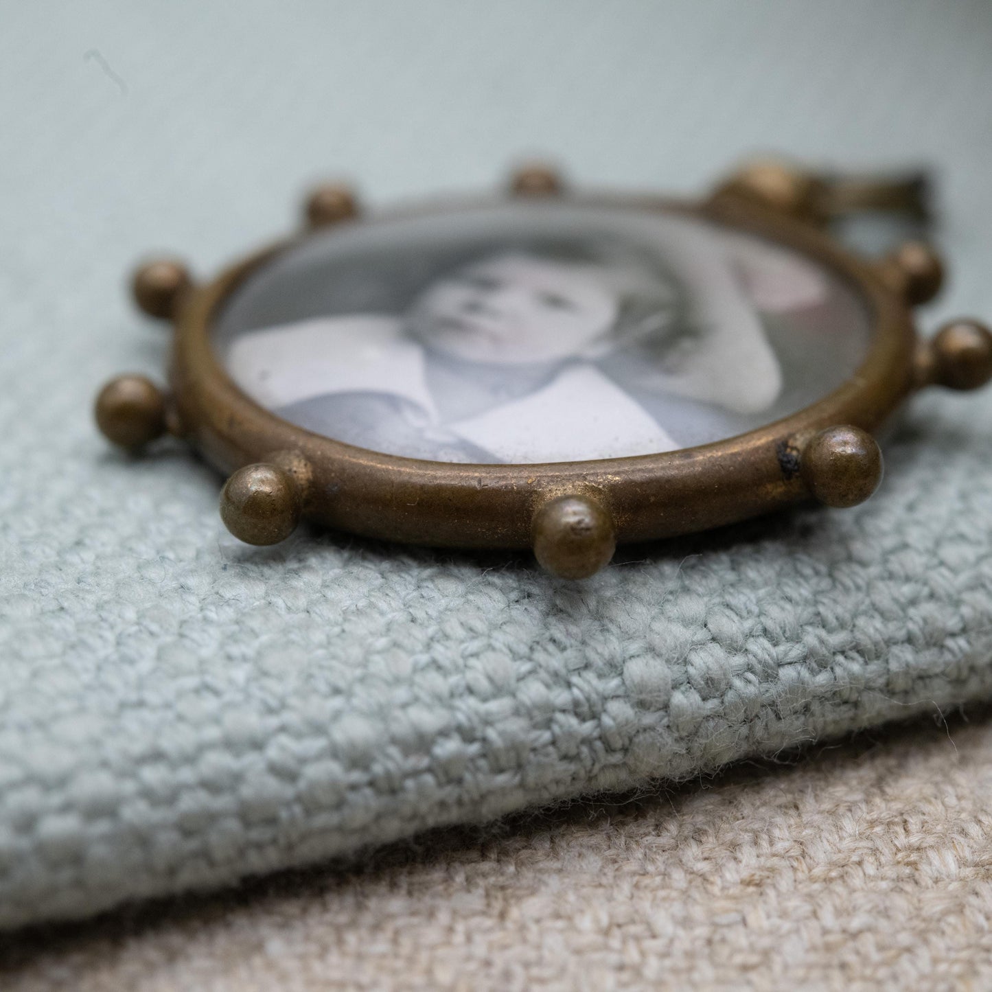 Antique Double Sided Locket Pendant Fob with Photographs Inside c. 1910 - Ship's Wheel Design with Granulated Edges